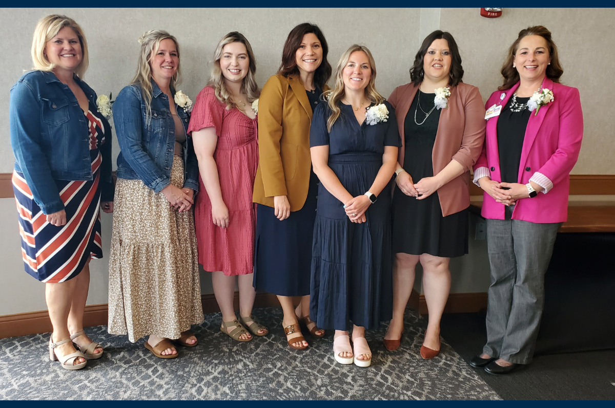 Women standing side by side